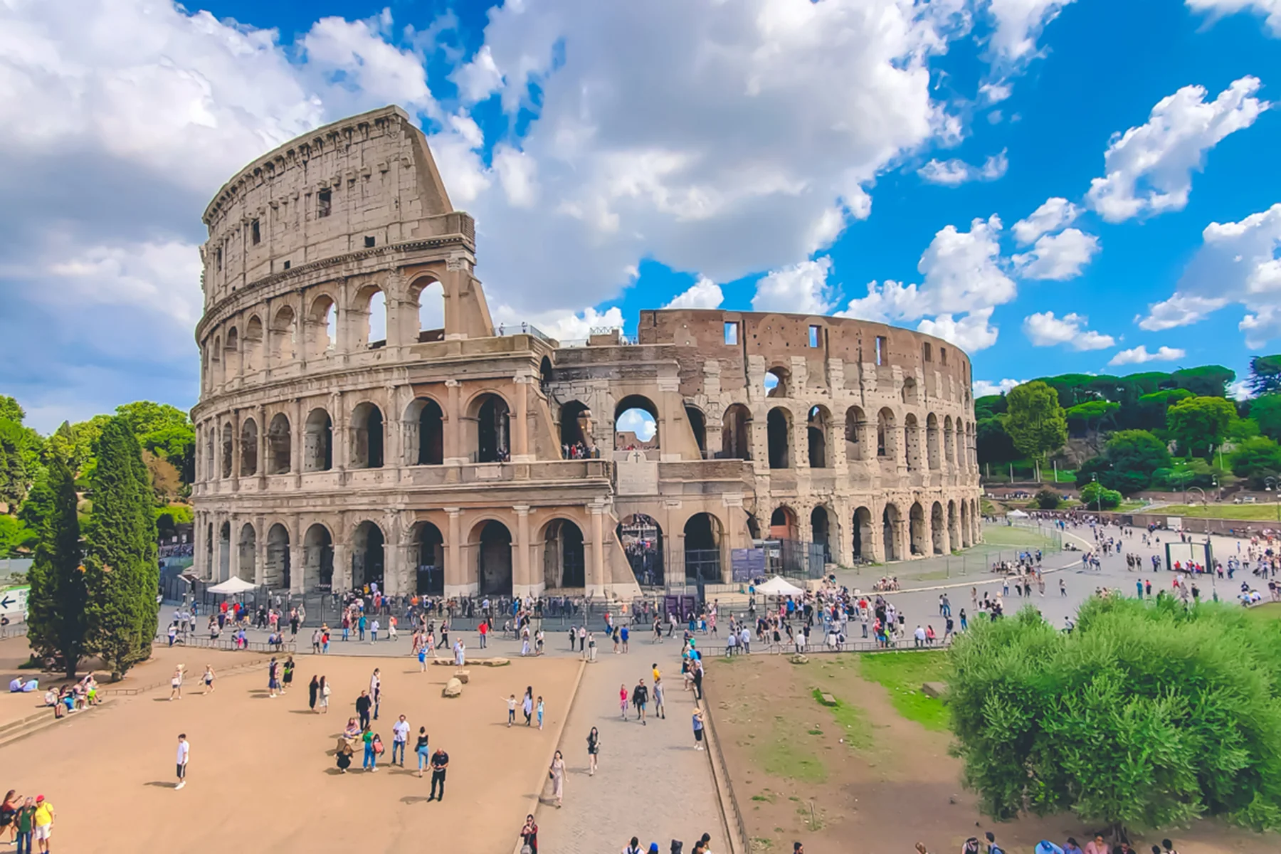Colosseum with clear blue sky and clouds, Rome,Italy. Rome architecture and landmark. Rome Colosseum is one of the best known monuments of Rome and Italy